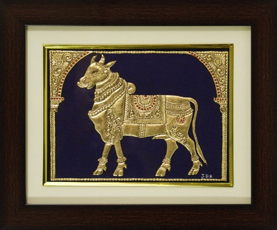Full-frame view of Golden Cow Mysore Painting with 22KT gold leaf, hand-painted in traditional Mysore style on paper, showcasing fine lines, intricate details, and rich ornamental textures, ideal for Indian heritage-inspired home décor.