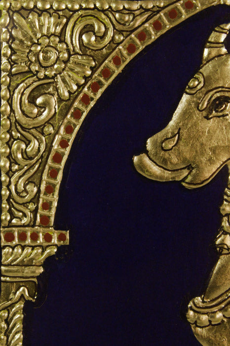 Close-up of Golden Cow Mysore Painting highlighting intricate Gesso relief work, 22KT gold leaf embellishments, and delicate brushwork, exemplifying the classical Mysore painting craftsmanship and ornate detailing.