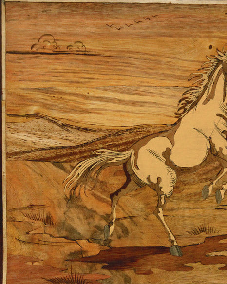 Close-up detail of Mysore rosewood inlay artwork highlighting finely fitted natural wood inlay and craftsmanship in a horse playing scene.

