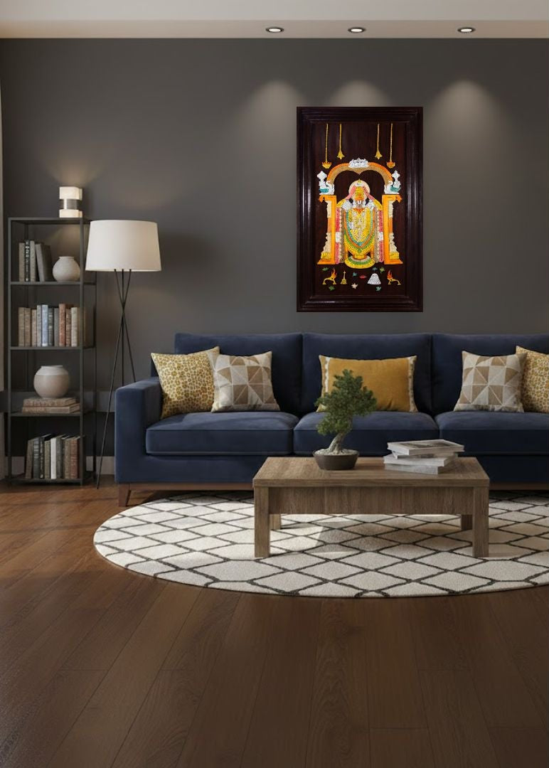 Mysore rosewood inlay artwork of Lord Venkateshwara in a three-dimensional style displayed in a living room setting, mounted on a wall with warm lighting, showcasing traditional Indian craftsmanship and devotional art