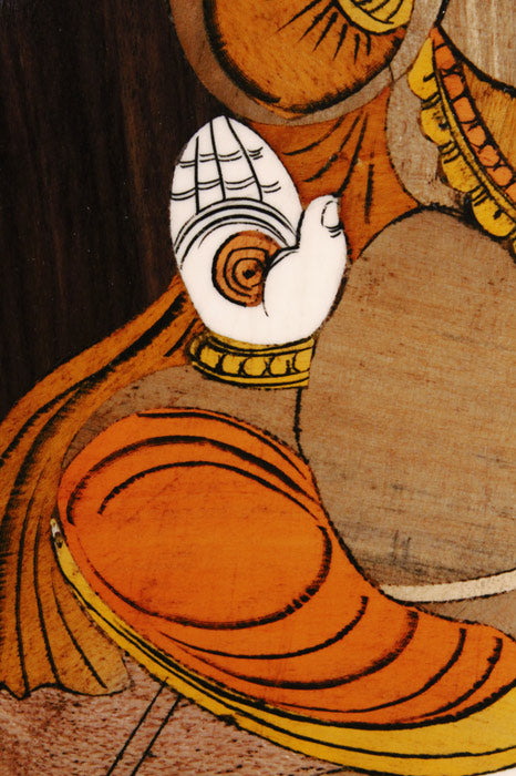 Close-up of intricate Mysore rosewood inlay detailing on a Ganesha wall panel, highlighting fine hand-cut wood inlay, flowing contours, layered textures, and traditional craftsmanship.