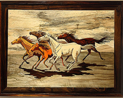 Framed artwork of horses running on a textured background