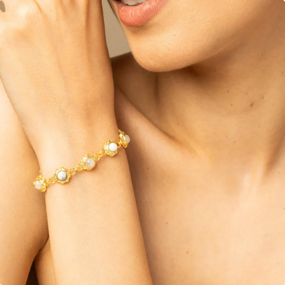18k gold-plated moonstone and howlite bracelet on wrist, modern unisex statement jewelry