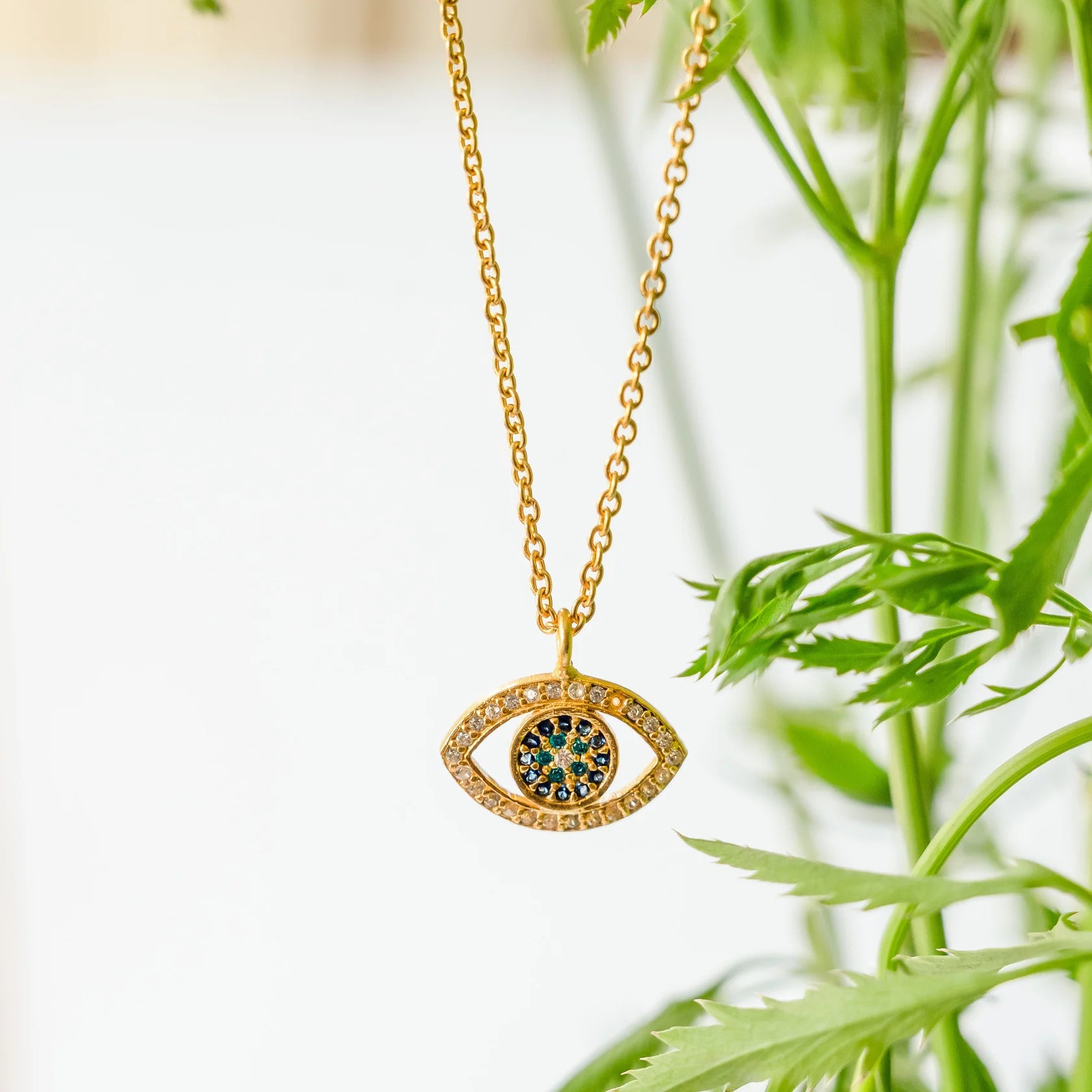 delicate gold-plated evil eye pendant necklace with cubic zirconia, modern spiritual jewelry for women