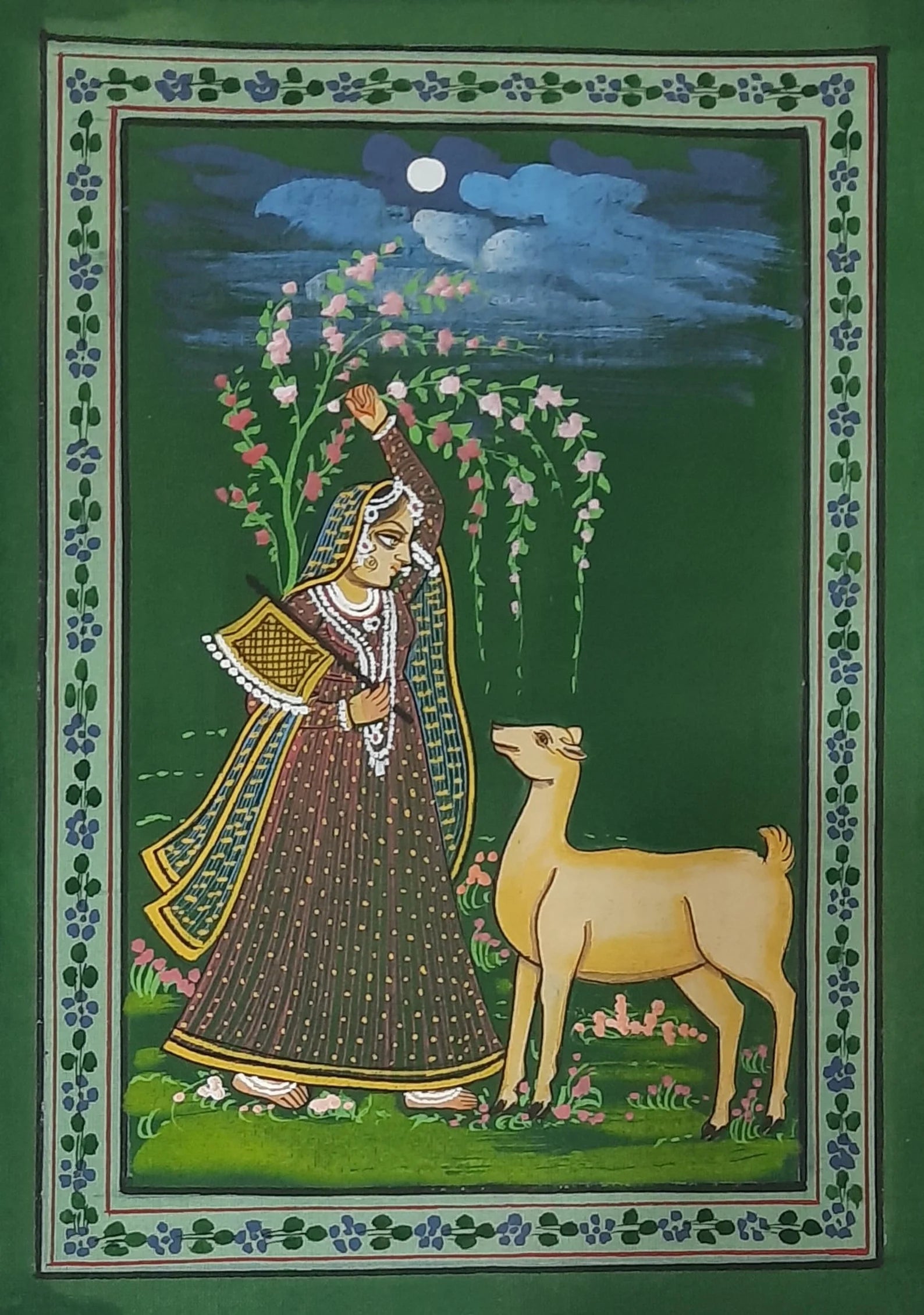 Ragamala miniature artwork portraying a romantic forest scene tied to musical emotion
