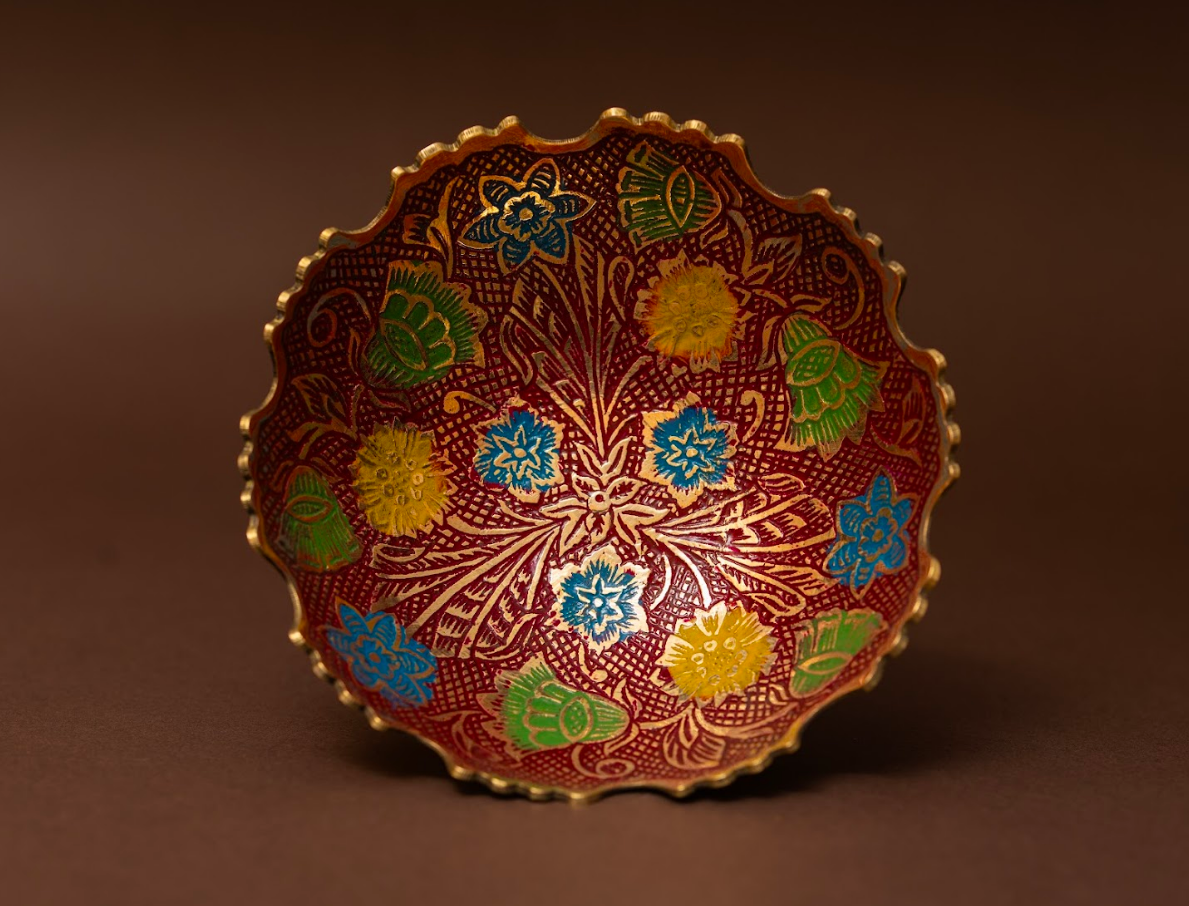 Handcrafted brass fruit bowl with white enamel floral design