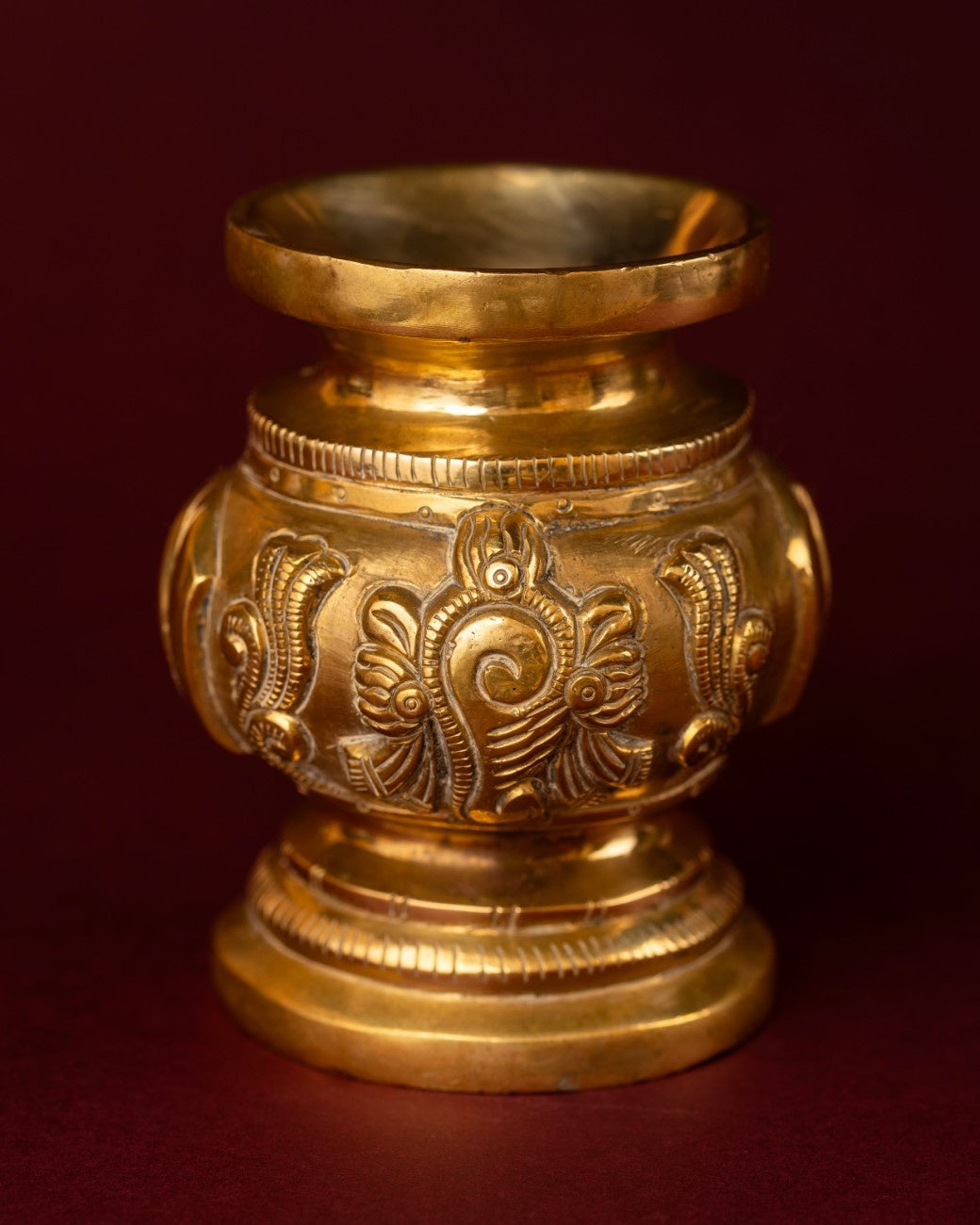 A brass pot with engraving