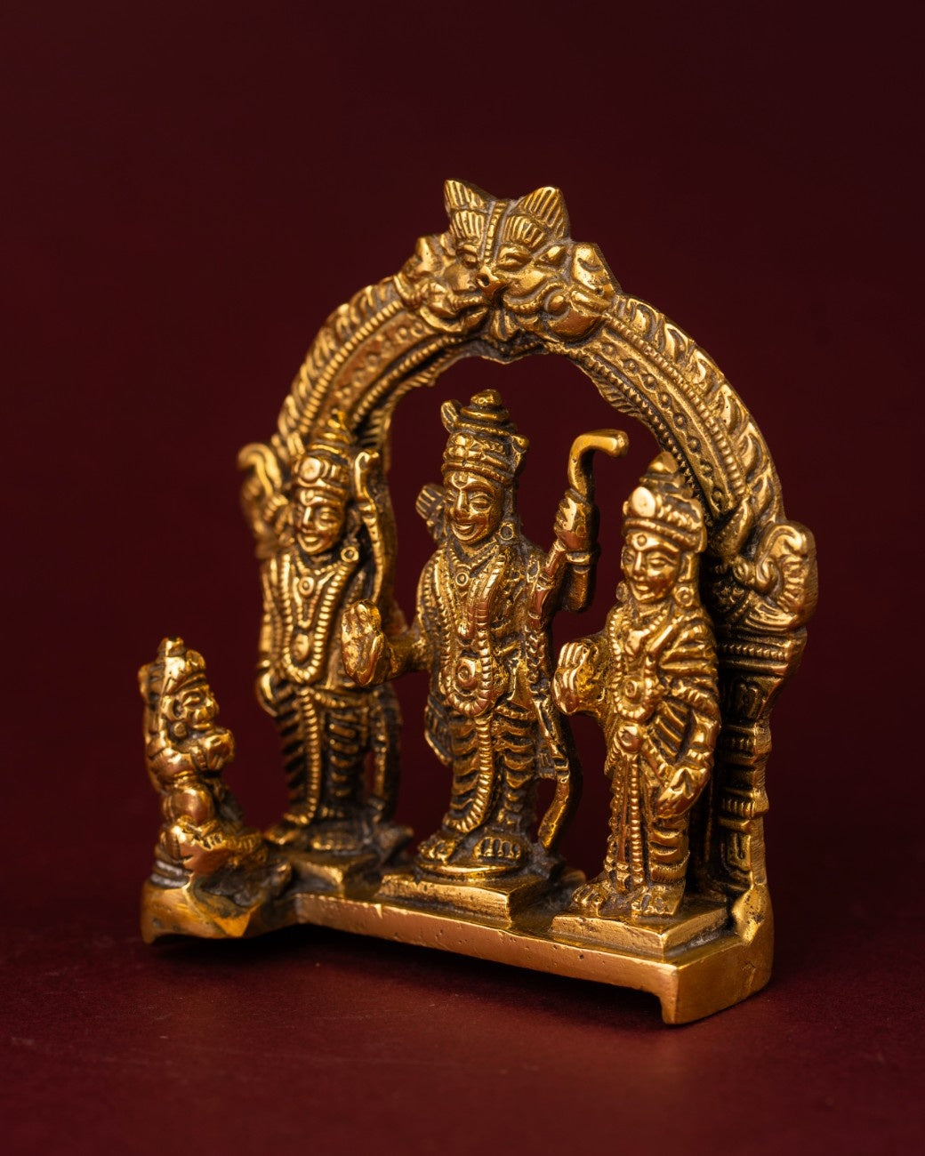 Angled brass Ram Darbar Traditional sculpture featuring Sita, Lakshmana, and Hanuman with ornate artwork and carved textures
