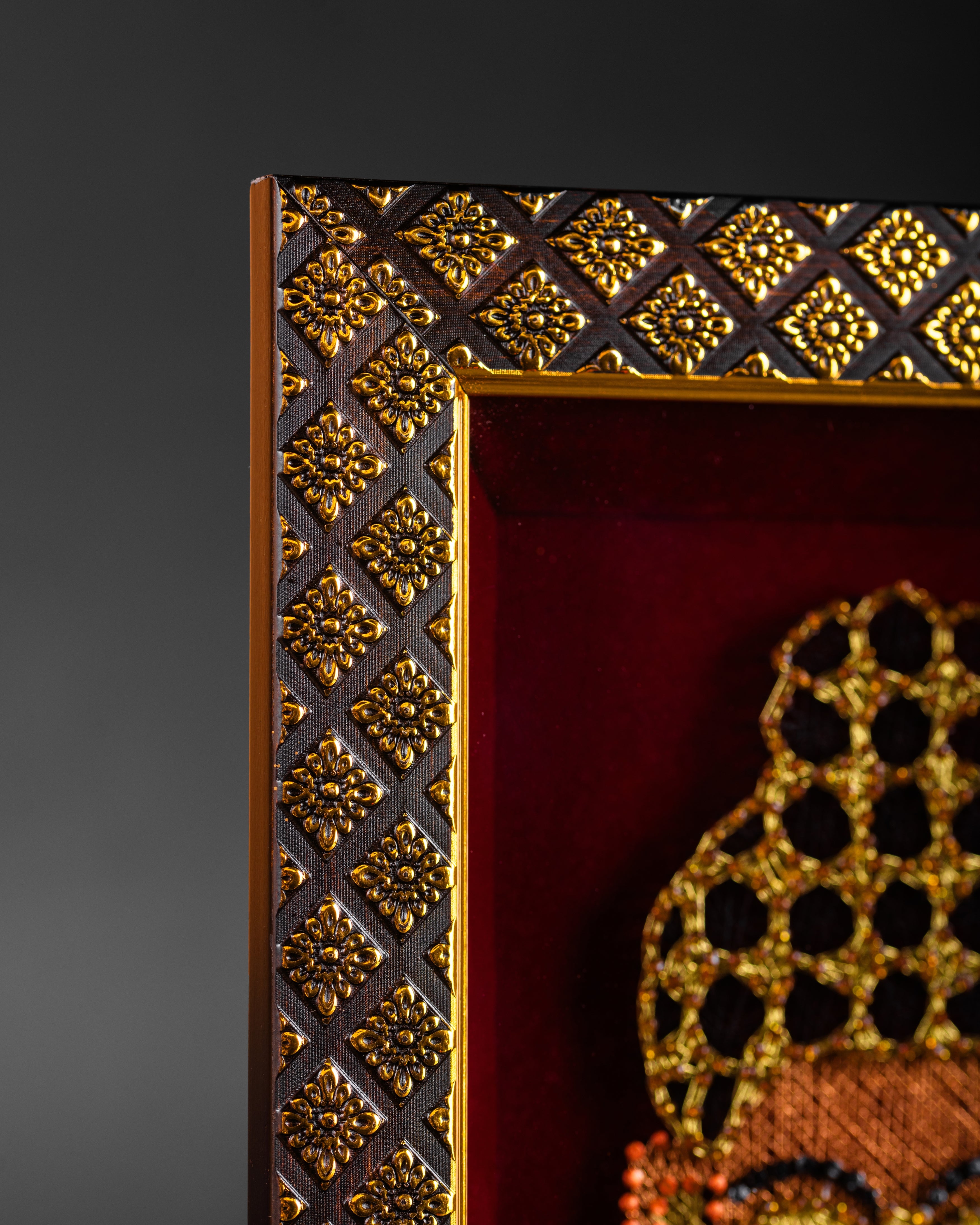 Close-up of Buddha Zardozi embroidery showing intricate metallic thread work