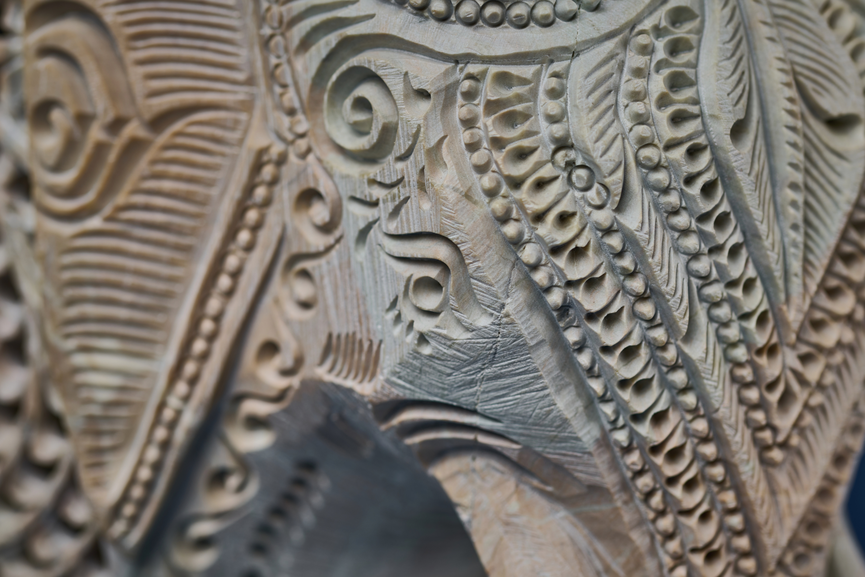 Carved white stone elephant artwork showcasing traditional artistry and auspicious symbolism
