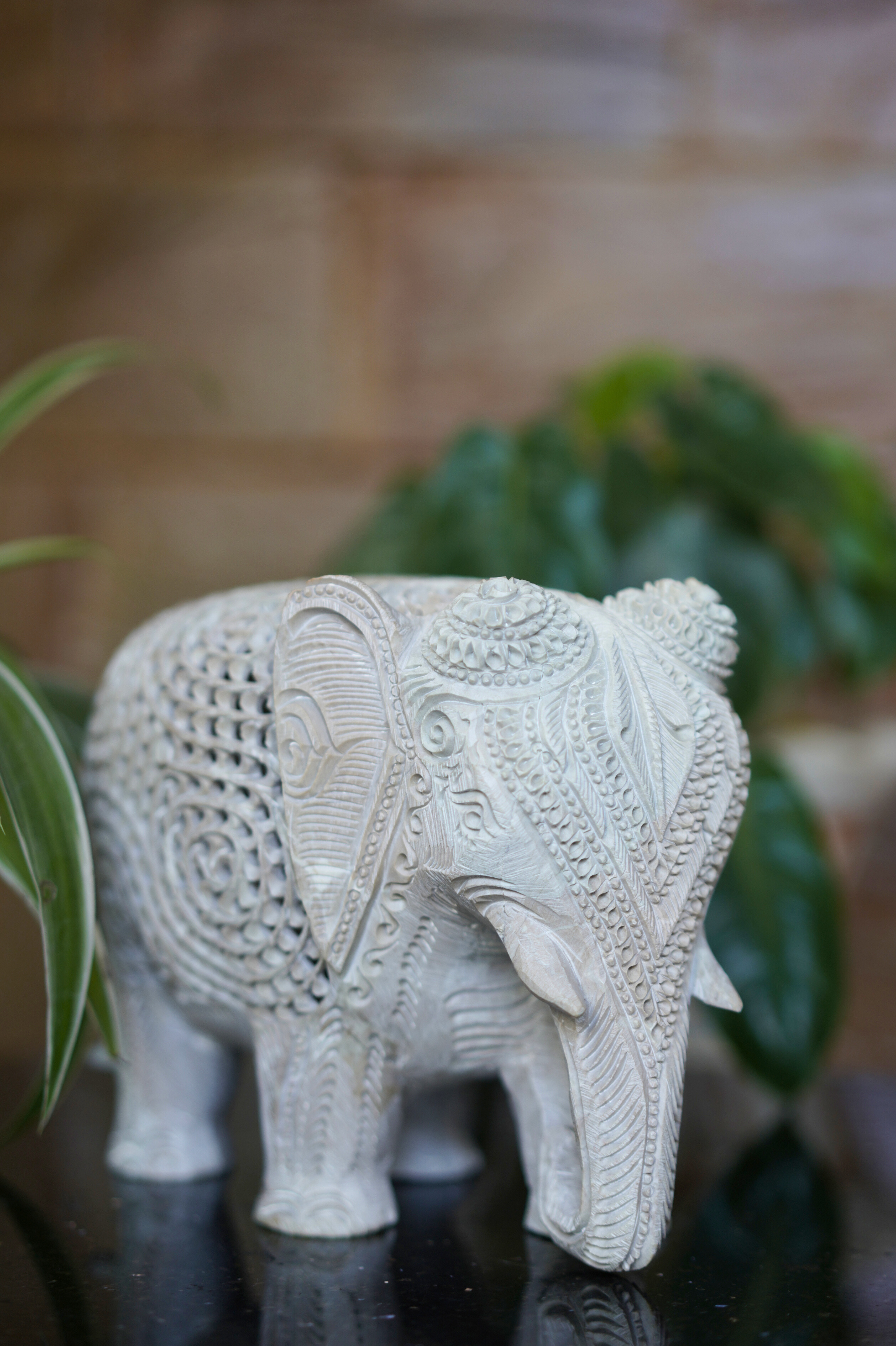 Hand carved white stone elephant sculpture symbolizing wisdom, strength, and good fortune for elegant home décor