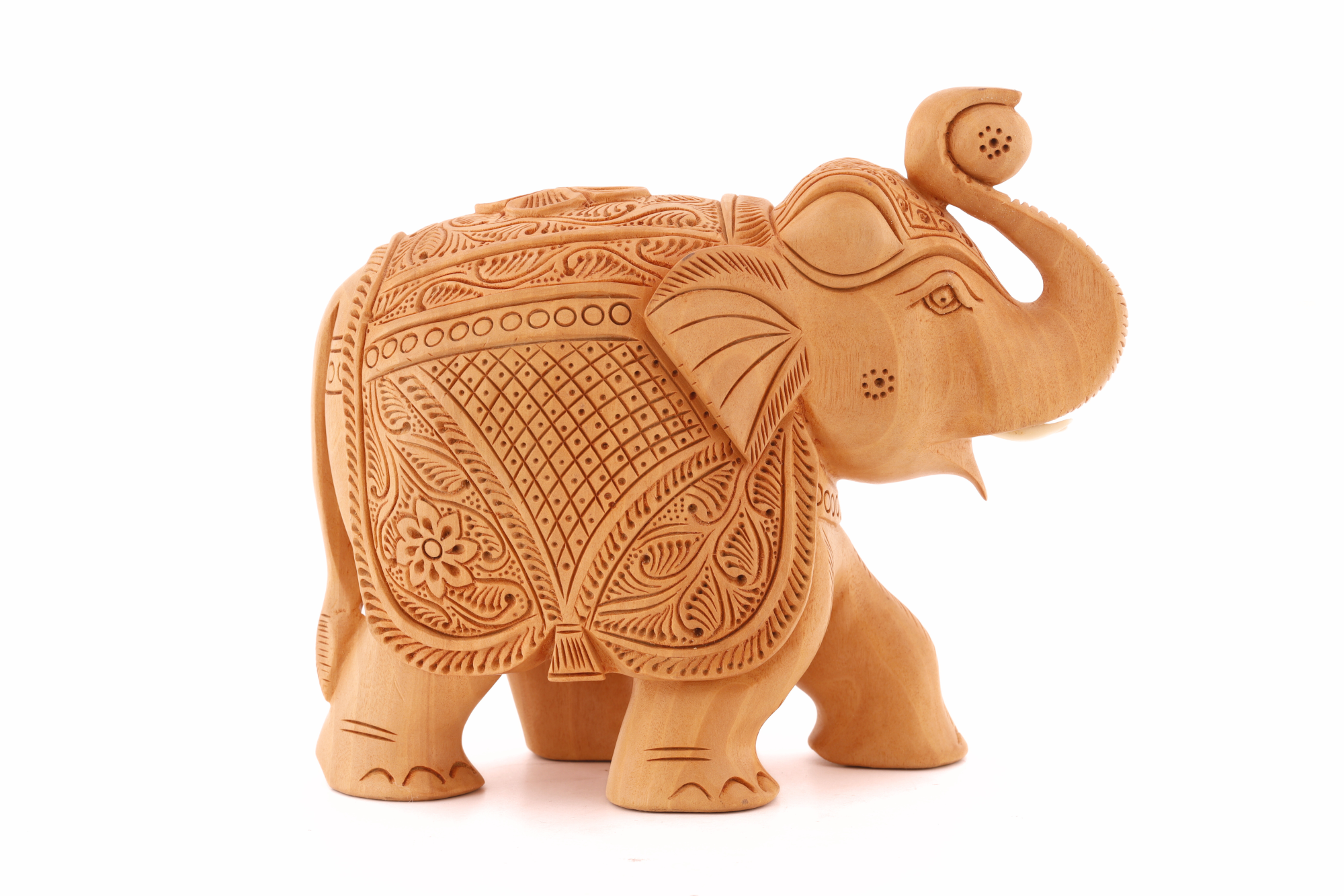 Carved wood elephant décor piece featuring refined detailing and a warm, natural aesthetic