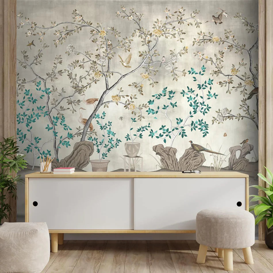 Luxury chinoiserie wallpaper with delicate flowering branches and birds, blending Indian and Asian influences for elegant heritage-inspired interiors.