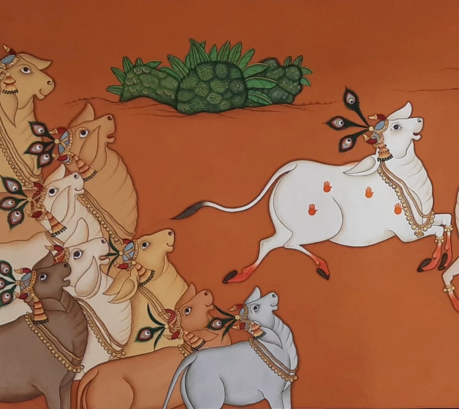 Pichwai painting of cows rendered in vibrant colours on cloth