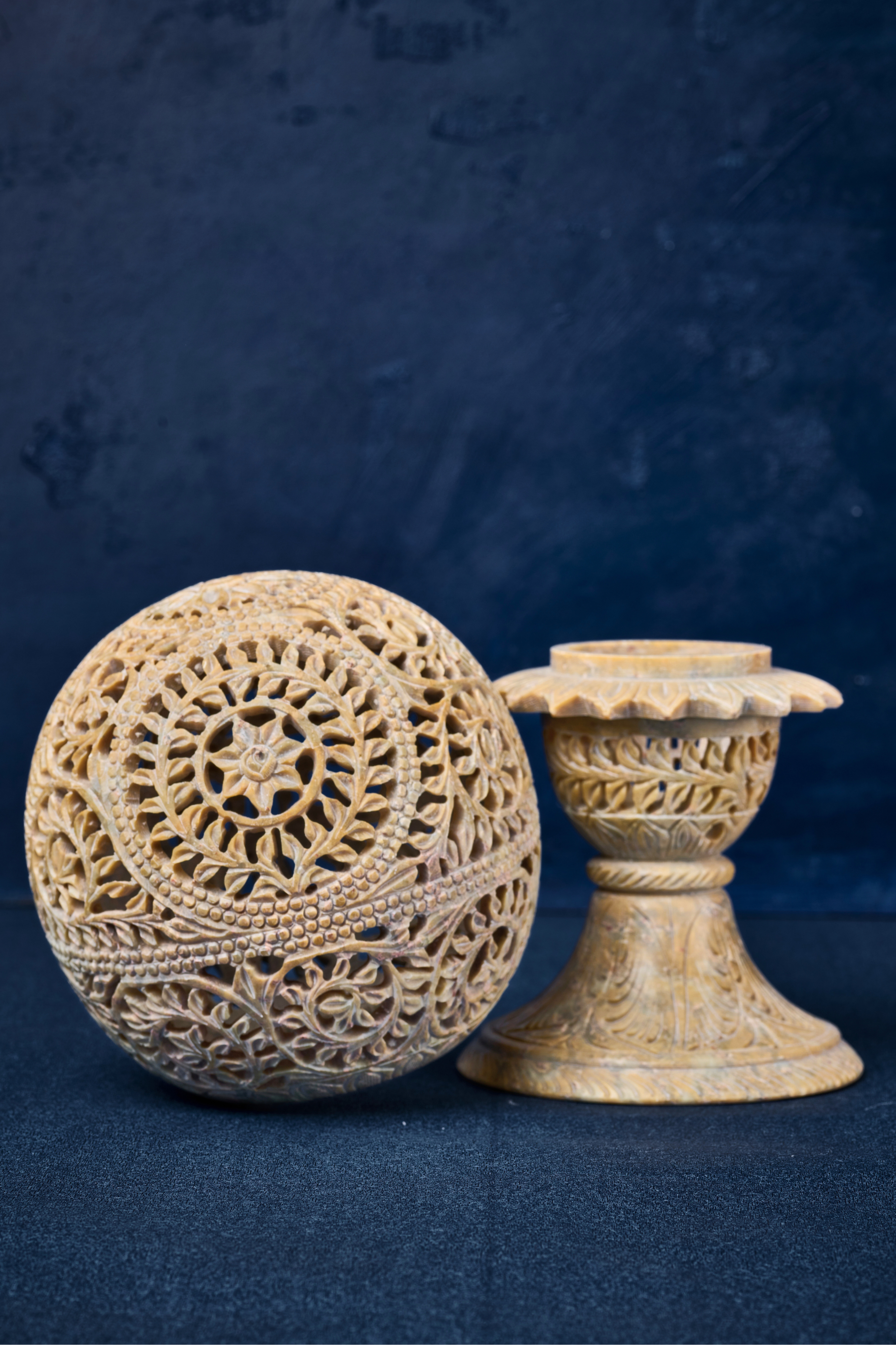 Handcrafted beige stone lampshade highlighting detailed workmanship and a serene, natural lighting aesthetic