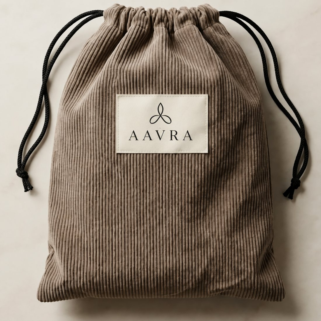 Corduroy gift bag with a client logo on the label