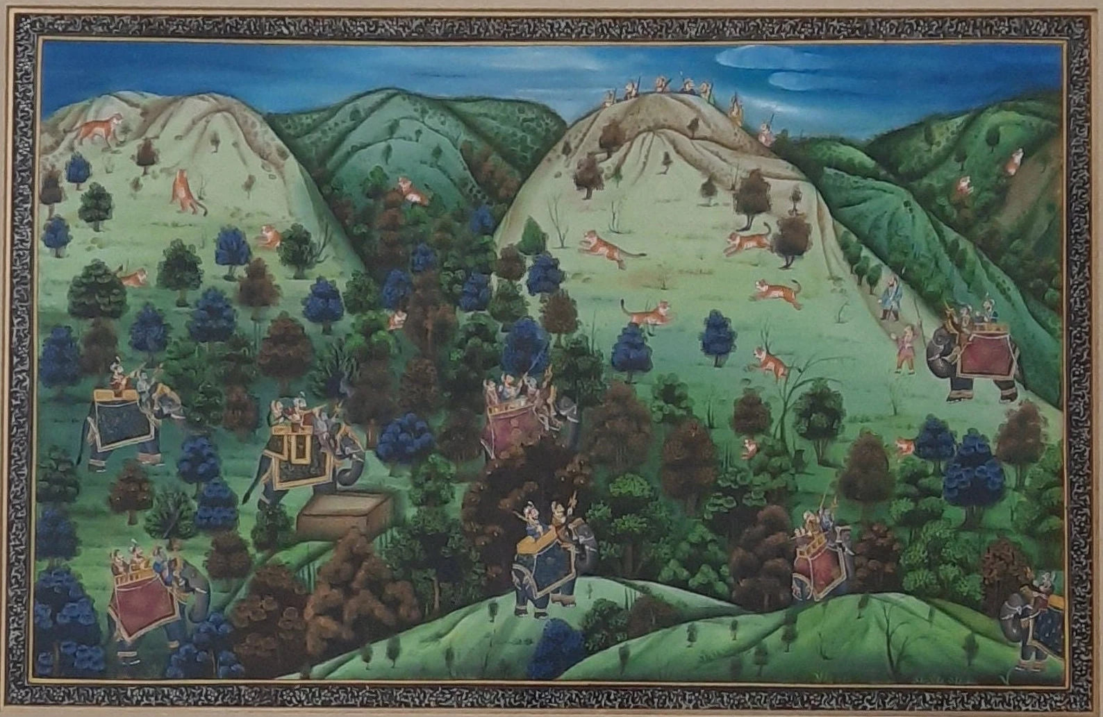 Silk painting depicting an Indian Maharaja hunting in a detailed royal landscape
