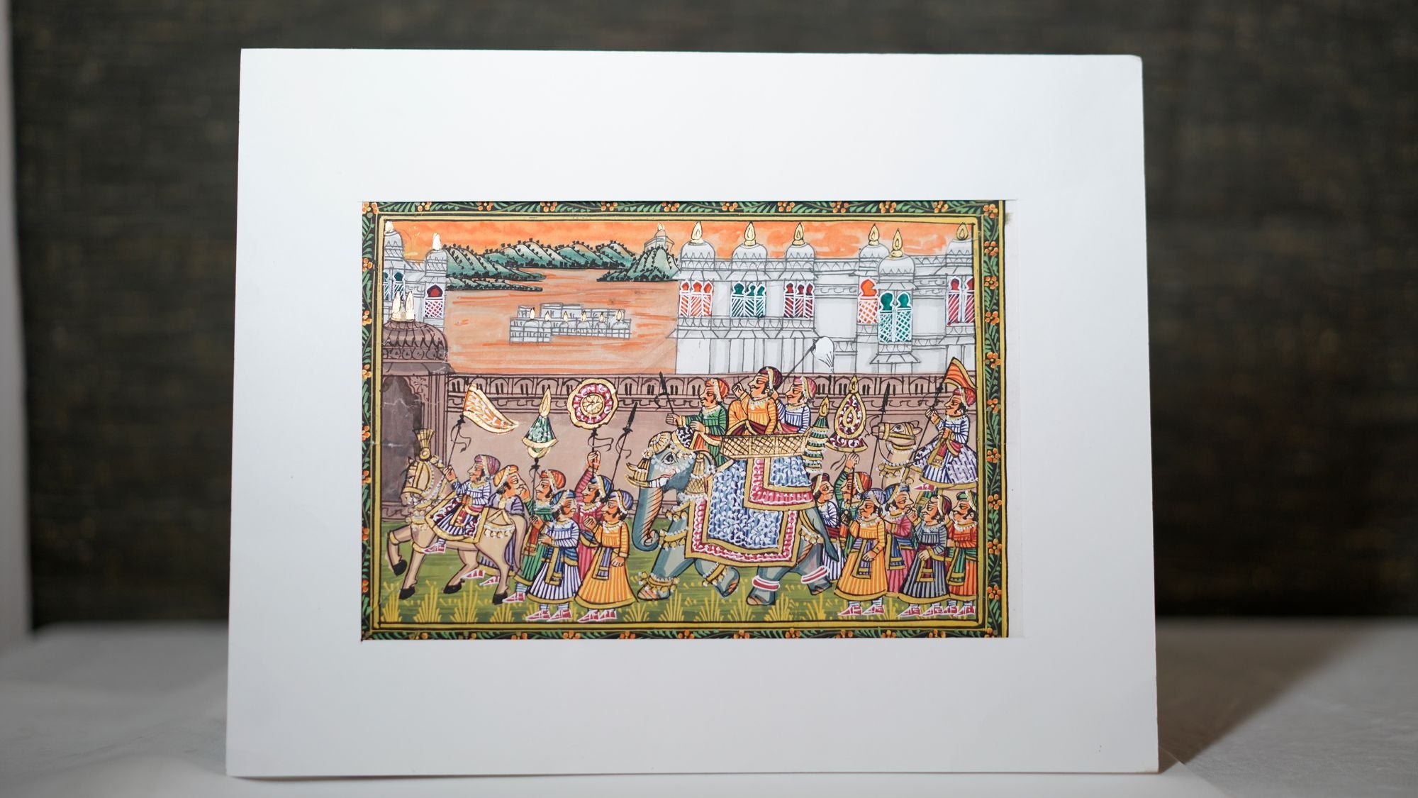 Marching orange army sculpture featuring a line of figurines in motion, symbolizing unity, strength, and bold artistic expression for home décor