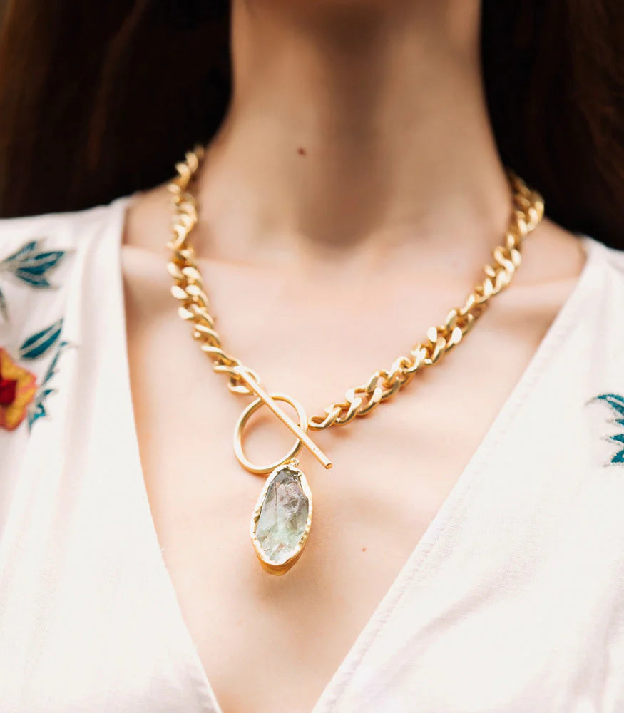 Gold-plated green amethyst pendant necklace styled on model for everyday wear