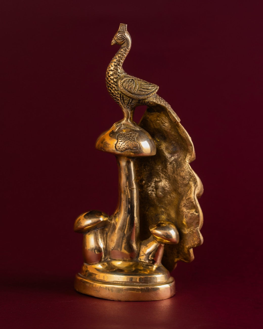 Detailed craftsmanship on brass peacock sculpture – traditional brass statue of peacock feathers