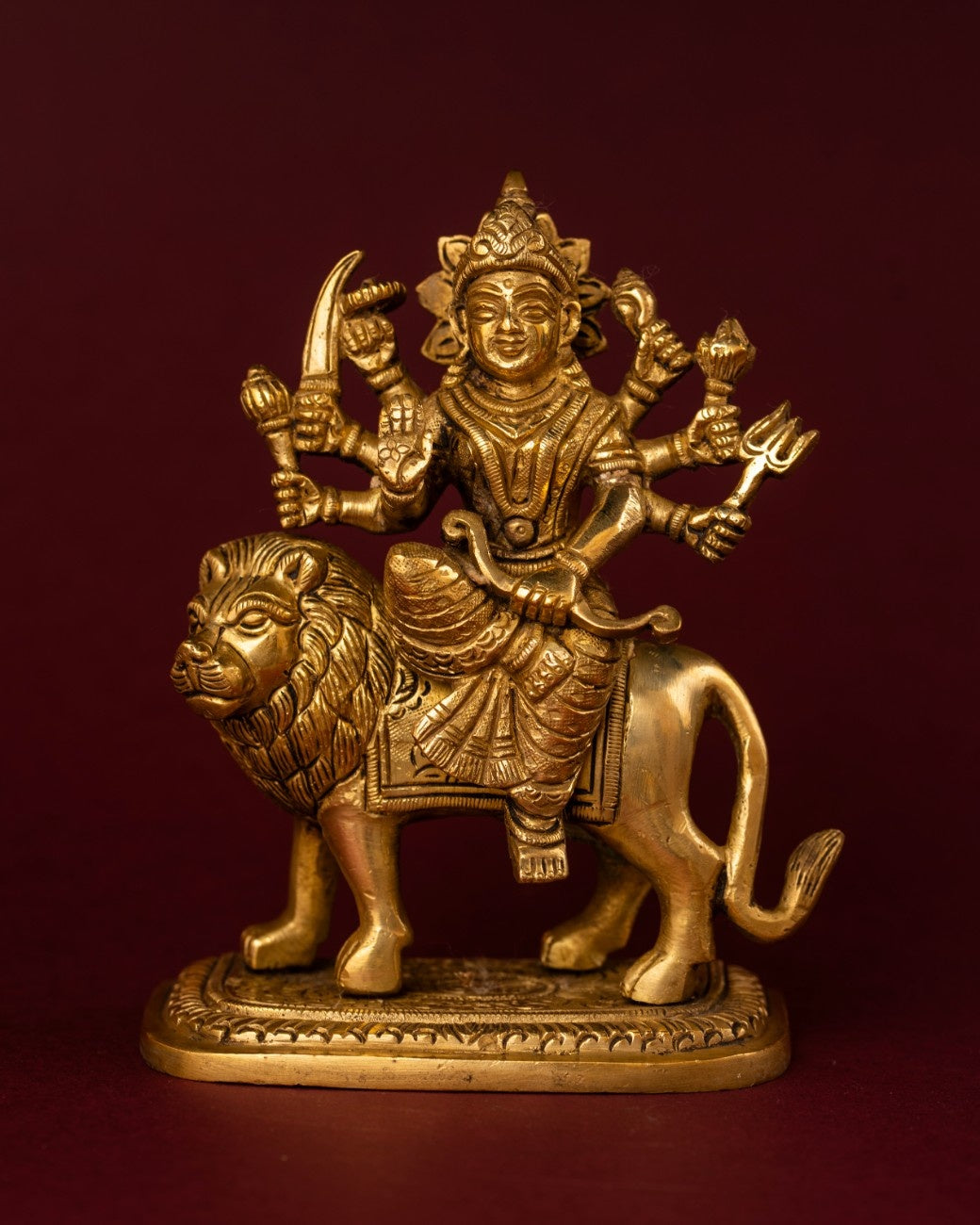 Brass statue of saraswati sitting on lion