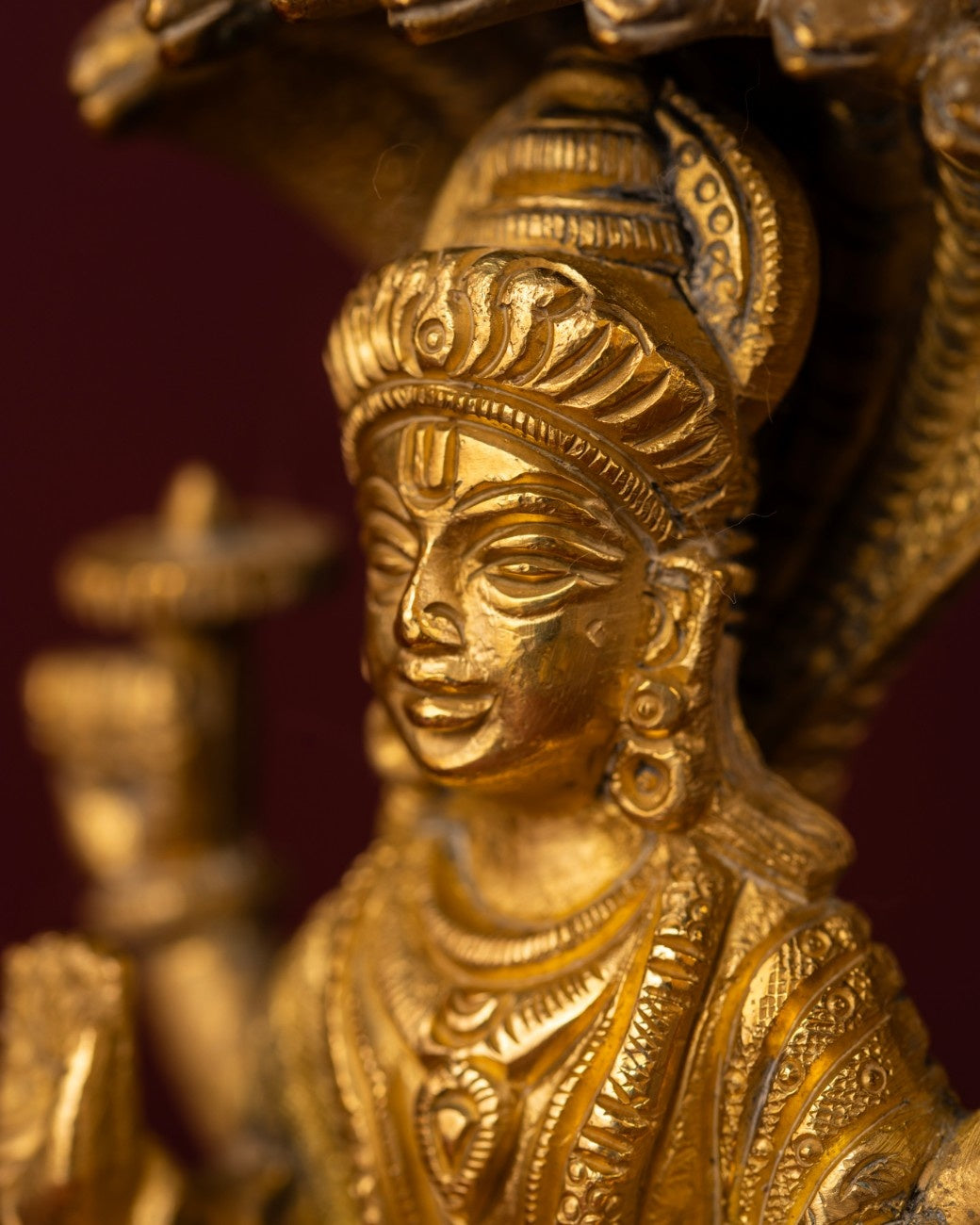 Close-up of Shiva brass statue face with calm meditative expression