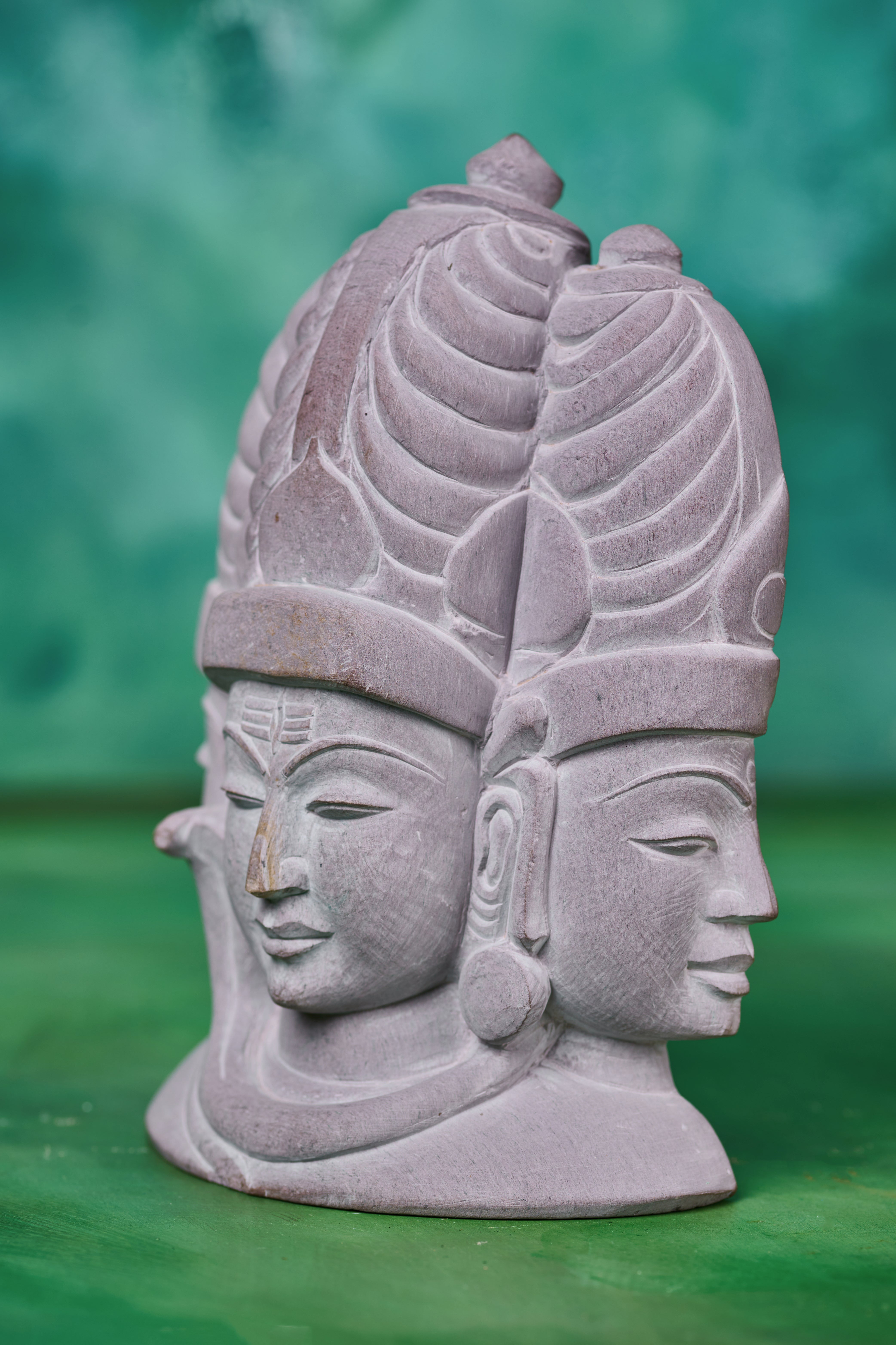 Shiva trinity décor statue carved in stone, created as a meaningful spiritual accent for home or temple settings