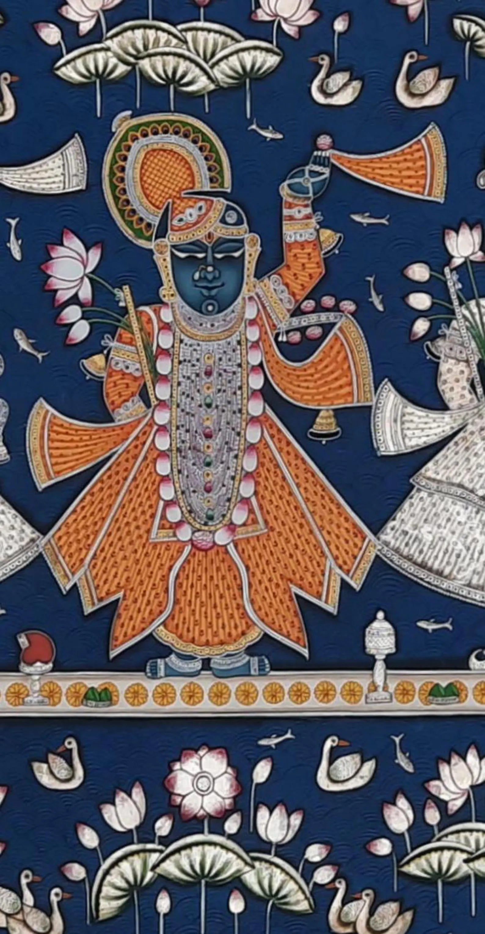 Detail view of attendant figure in a Shrinathji Pichwai painting with traditional attire and symbolic floral elements