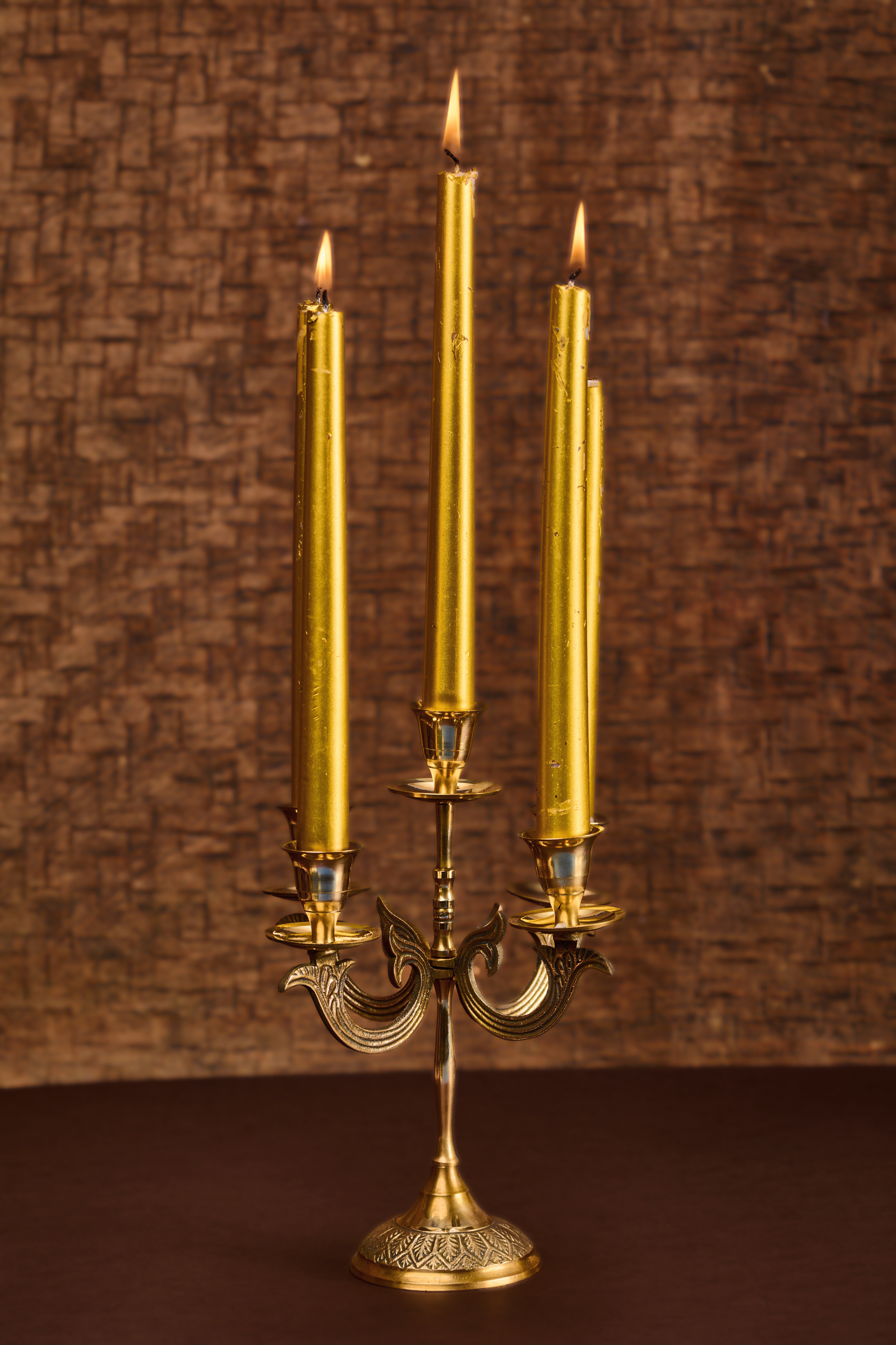 Victorian brass candle holder with elaborate design elements adding vintage charm and warm ambience to interiors